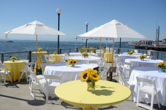 Seattle-Corporate-Event-Planning-Picnic-on-Pier-Waterfront-Sunflowers-and-yellow-tables